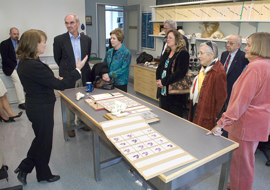 Darlene Ketten (at left) showing trustee tour group the WHOI CSI.