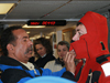R/V Oceanus first mate Diego Mello (left) helps WHOI Postdoc Tim Shanahan get into his 'Gumby' suit.