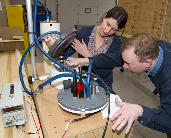 Kate McMonagle and John Lund work on a carbon dioxide sensor
