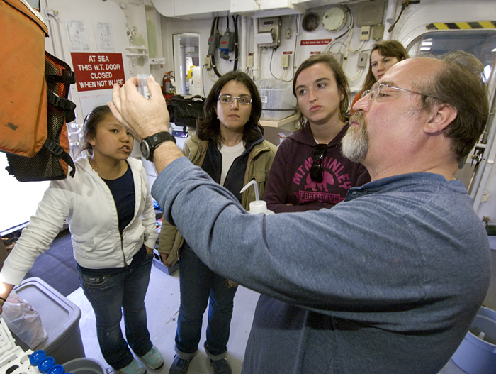 Bruce Keafer demonstrates how to filter seawater to get red tide algae samples