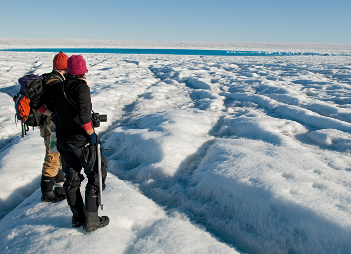 Sarah Das and Ian Joughin view supraglacial lake on Greenland ice sheet