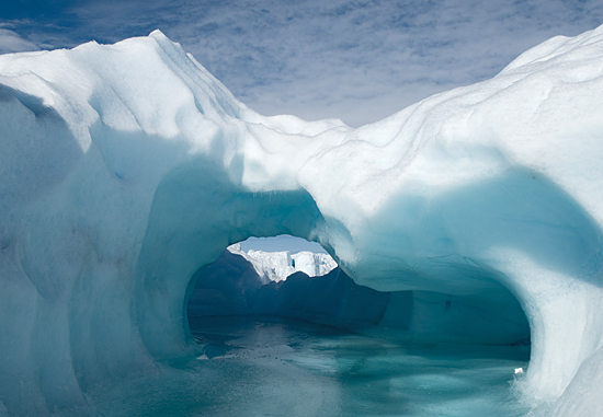 Icy moulin cave created by lake drainage.