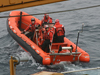 Team from USCGC Healy departing on a Hurricane tender.