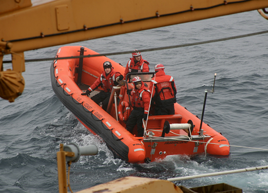 Team from USCGC Healy departing on a Hurricane tender.
