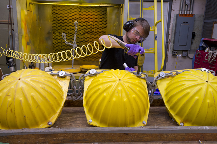 Matthew Adams works on hardhat floats