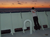 Nika Staglicic on open deck watching the sunrise on the LADDER 3 cruise.