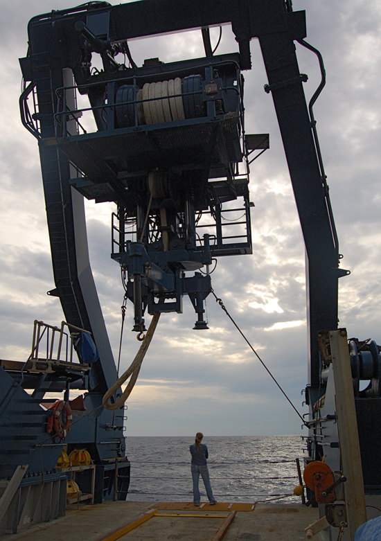 Skylar Bayer dwarfed by the R/V Atlantis A-frame.