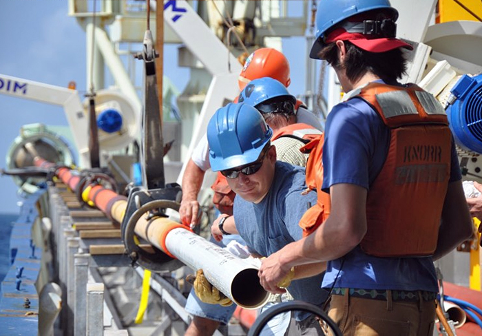 a liner of PVC pipe being inserted into WHOI's long corer