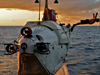 Alvin swimmer dives at sunset