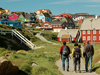 Sarah Das, center, and colleagues entering a village during the July 2007 expedition to Greenland.