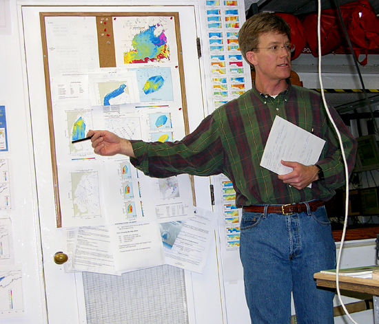 Dennis McGillicuddy reviewing data during cruise.
