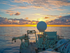 sunset at sea, looking over aft deck of RV Knorr