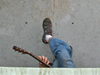 Ronnie Whims, AB on Oceanus, plays guitar on deck near a Craib corer.