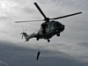 Pete Liarikos, Bosun on the Knorr, rises into an Icelandic coast guard helicopter during cruise KN189-04.