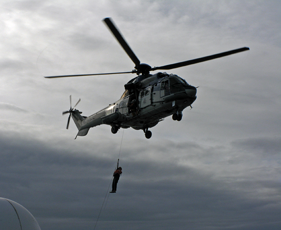 Pete Liarikos, Bosun on the Knorr, rises into an Icelandic coast guard helicopter during cruise KN189-04.