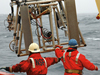 Researchers and crew aboard the R/V Laurence M. Gould recover a new Large Area Plankton Imaging System (LAPIS) after a test in Antarctic waters in March 2006.