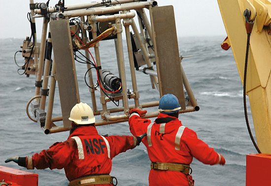 Researchers and crew aboard the R/V Laurence M. Gould recover a new Large Area Plankton Imaging System (LAPIS) after a test in Antarctic waters in March 2006.