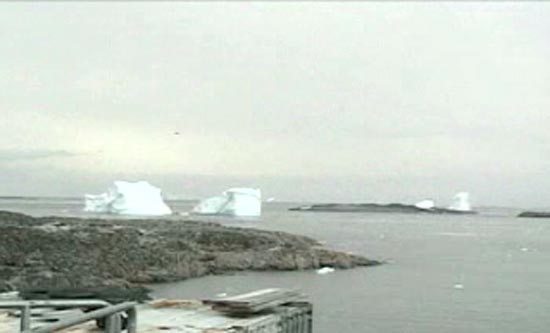 Two icebergs pirouette off Palmer Station