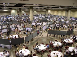 500 posters cram a cavernous meeting hall