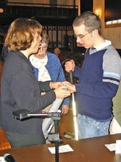 image of Dr. Bower describing a water sample bottle to a student