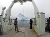R/V Knorr backing up to an iceberg off the coast of Baffin Island