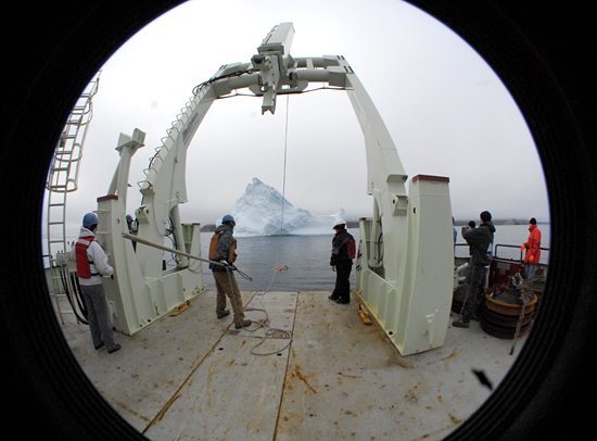 R/V Knorr backing up to an iceberg off the coast of Baffin Island