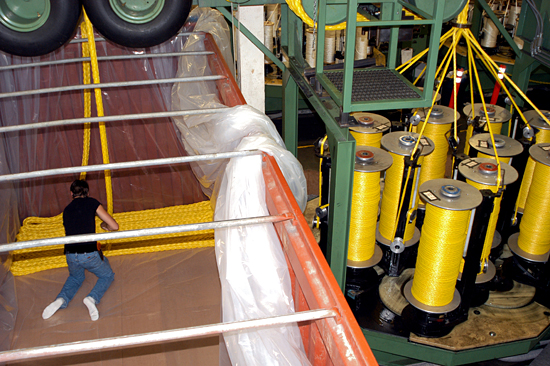 At Puget Sound Ropes in Anacortes, WA, the first few meters of a new synthetic rope are flaked into a shipping container.