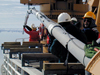 An 80 foot long ?Jumbo? piston core is launched from the deck of the USCG icebreaker Healy