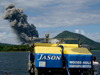 The ROV Jason II and Robert Fuhrmann look on as Mount Tavurvur belches ash.