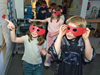 Tinted glasses and a darkened classroom helped fourth-graders experience how bright red fish exploit colors and lack of light to avoid predators.