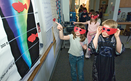 Tinted glasses and a darkened classroom helped fourth-graders experience how bright red fish exploit colors and lack of light to avoid predators.