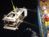 Researchers on R/V Oceanus deploy a sampling sled.