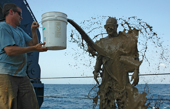 When Mark Spear stepped out of the submersible Alvin as WHOI's newest deep-sea pilot, fellow pilot Gavin Eppard greeted him with a traditional baptism on the deck of R/V Atlantis