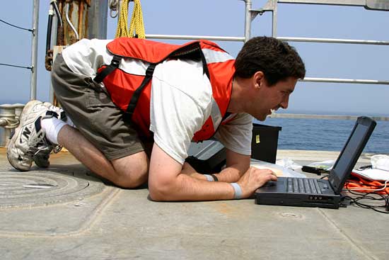 WHOI biologist Mark Baumgartner traveled on the research vessel Tioga offshore Woods Hole in 2005 to investigate where and how whales find their staple food, tiny crustaceans called copepods.