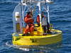 Crew repairing the gulf stream buoy in the water.