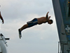 R/V Atlantis Steward Carl Wood leaps from DSV Alvin during launch.