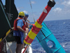 Researchers retrieve a sediment trap mooring with a ?holey sock? drogue