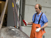 Michael Moore prepares a 12-foot Cuvier's beaked whale ((Ziphius cavirostris) for a necrospy.