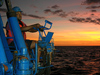Thomas Anthony operating the crane aboard R/V Melville 
