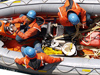 Crew in the zodiac as it heads out to repair the gulf stream buoy from the R/V Oceanus.