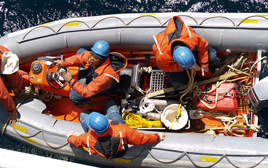 Crew in the zodiac as it heads out to repair the gulf stream buoy from the R/V Oceanus.