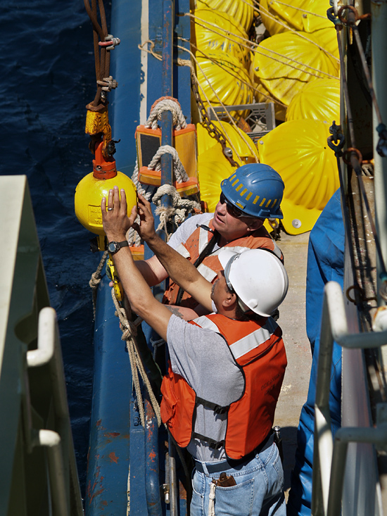 Ken Rand and Diego Mello (foreground) working on deck of R/V Oceanus.