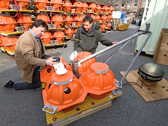 John Collins and Jeff McGuire are pictured with Ocean Bottom Seismometers