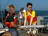 WHOI Summer Student Fellows learn coring techniques aboard the R/V Tioga.