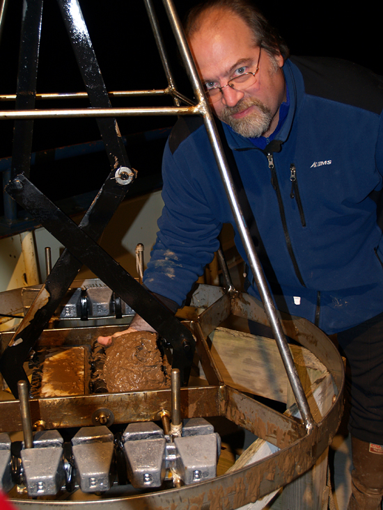 Bruce A. Keafer, pictured with retrieved sediment.