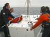 Scientists deploy an undersea node off the R/V Tioga near the ASIT tower of the MVCO.