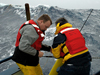 John Lund and Bob Weller deploy an APEX float off R/V Oceanus during rough weather.