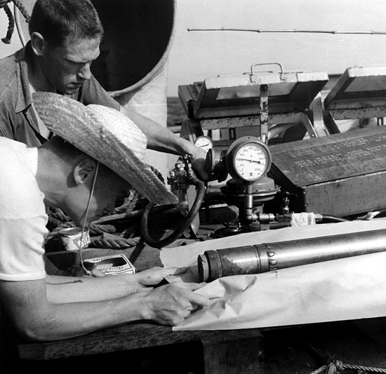 Dick Edwards and Dick Leahy working with core onboard Atlantis, circa 1959.