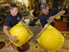 Kris Newhall and John Kemp examine and repair floats on board the Canadian icebreaker Louis S. St-Laurent.