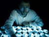 Paul Dunlap at work in his Redfield lab on bioluminescent bacteria.